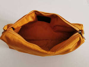 Rete bag with camel pouch