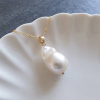 White lustrous baroque pearl pendant