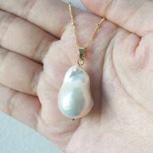 White lustrous baroque pearl pendant